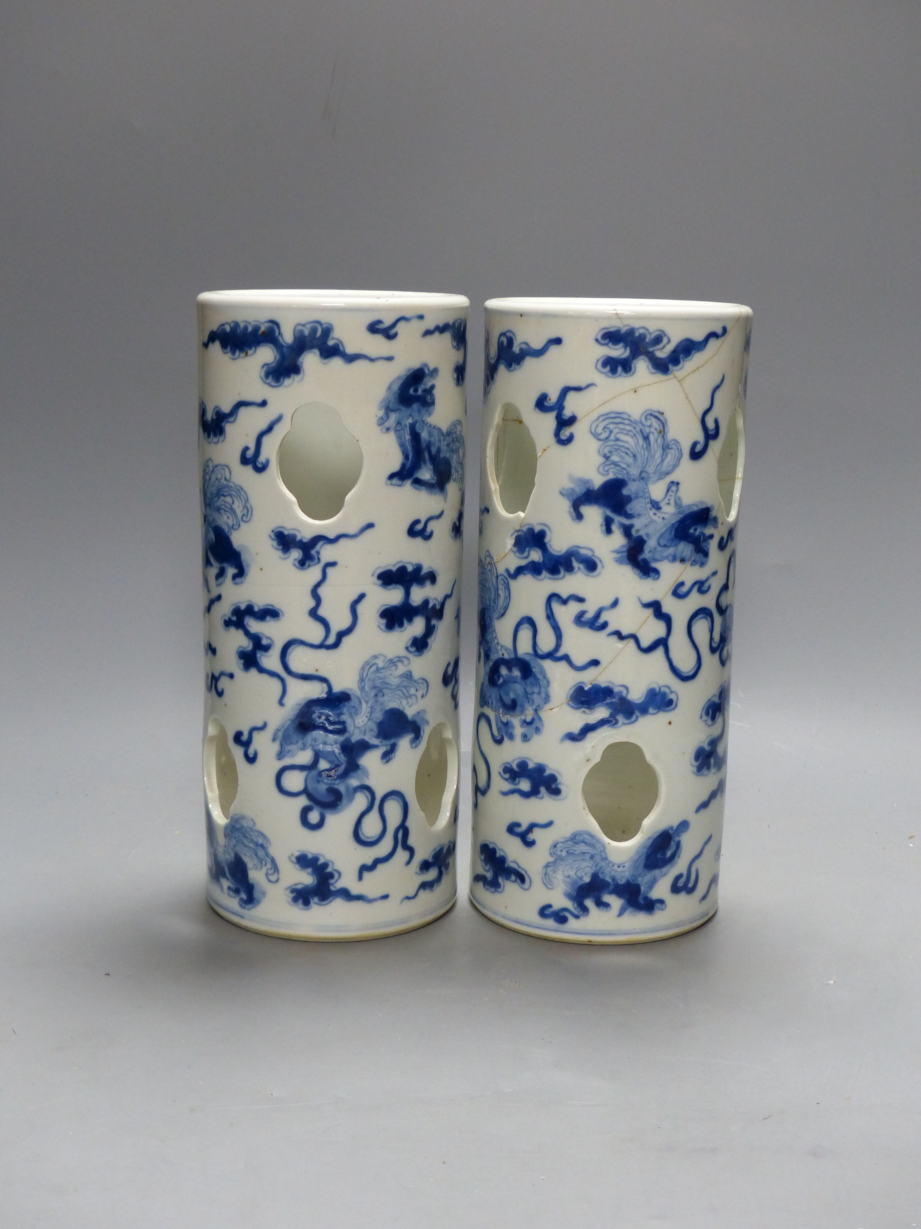 A pair of early 20th century Chinese blue and white hat stands, Kangxi marks, 29cm high